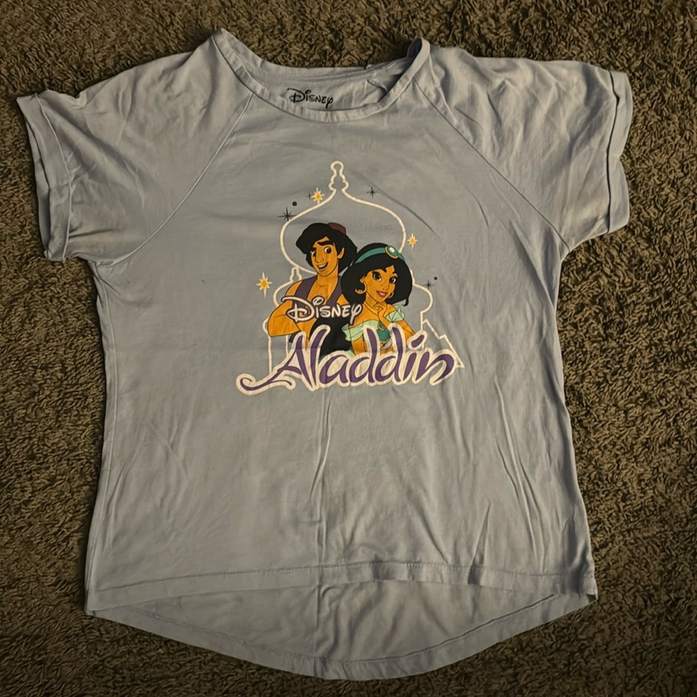 L (11-13) Blue Disney Aladdin shirt made with 58% cotton 42 polyester